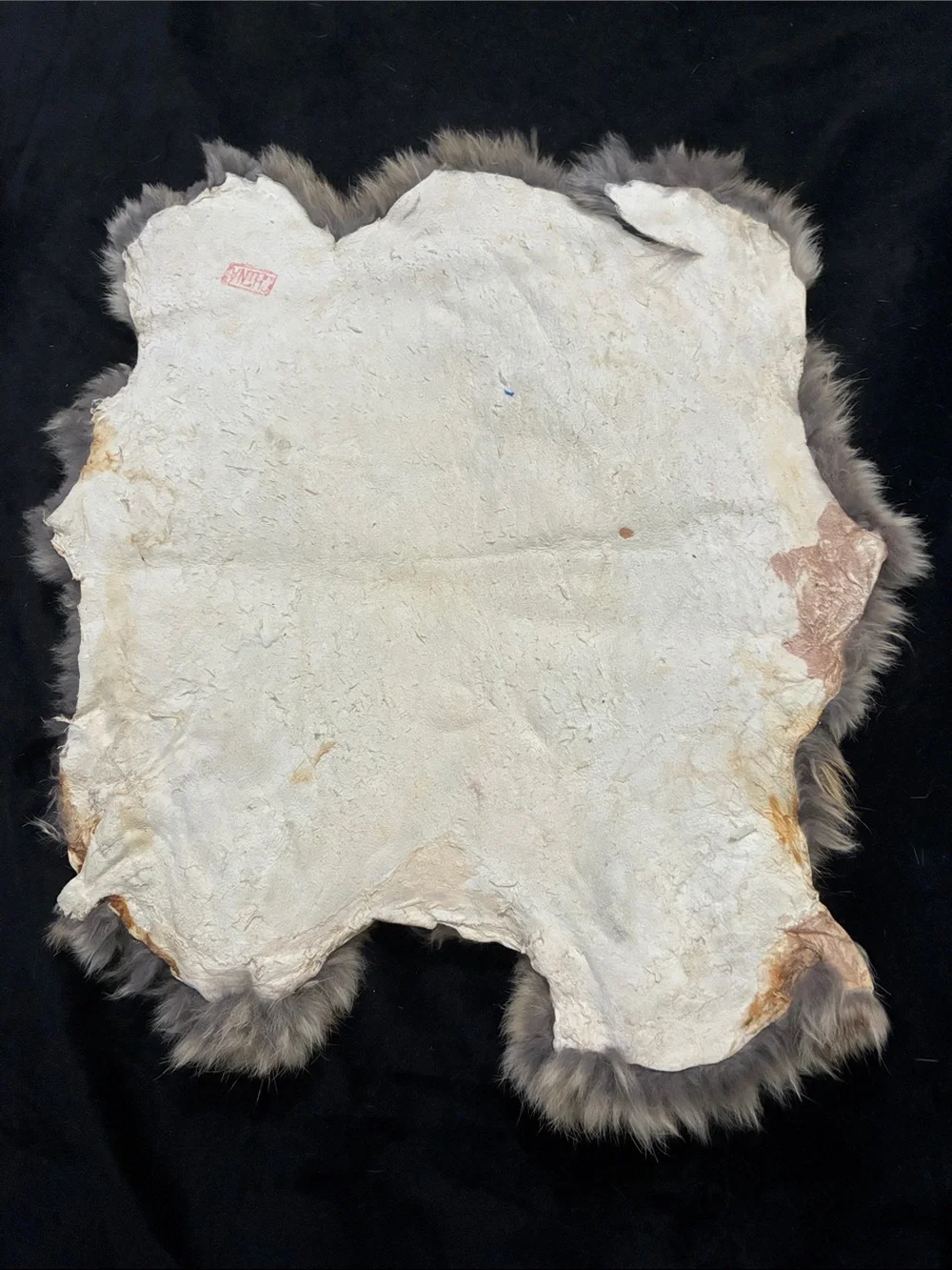 Southwestern-inspired 9” vase leather lacing, natural fur display mat